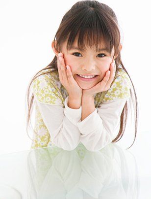 Smiling girl showing her white teeth - Dental Care in Woonsocket, Rhode Island Smiling girl showing her white teeth - Dental Care in Woonsocket, Rhode Island