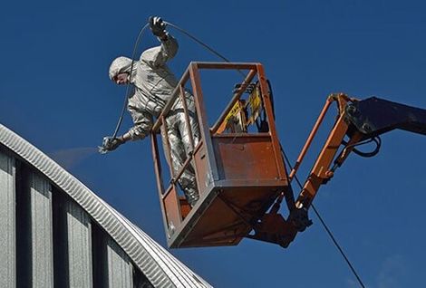 Mackay Painter doing Commercial Painting Using Spray Gun - Mackay, QLD