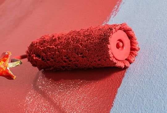 Wall Painting with a Roller Brush Red Wall Painting with a Roller Brush - Mackay, QLD