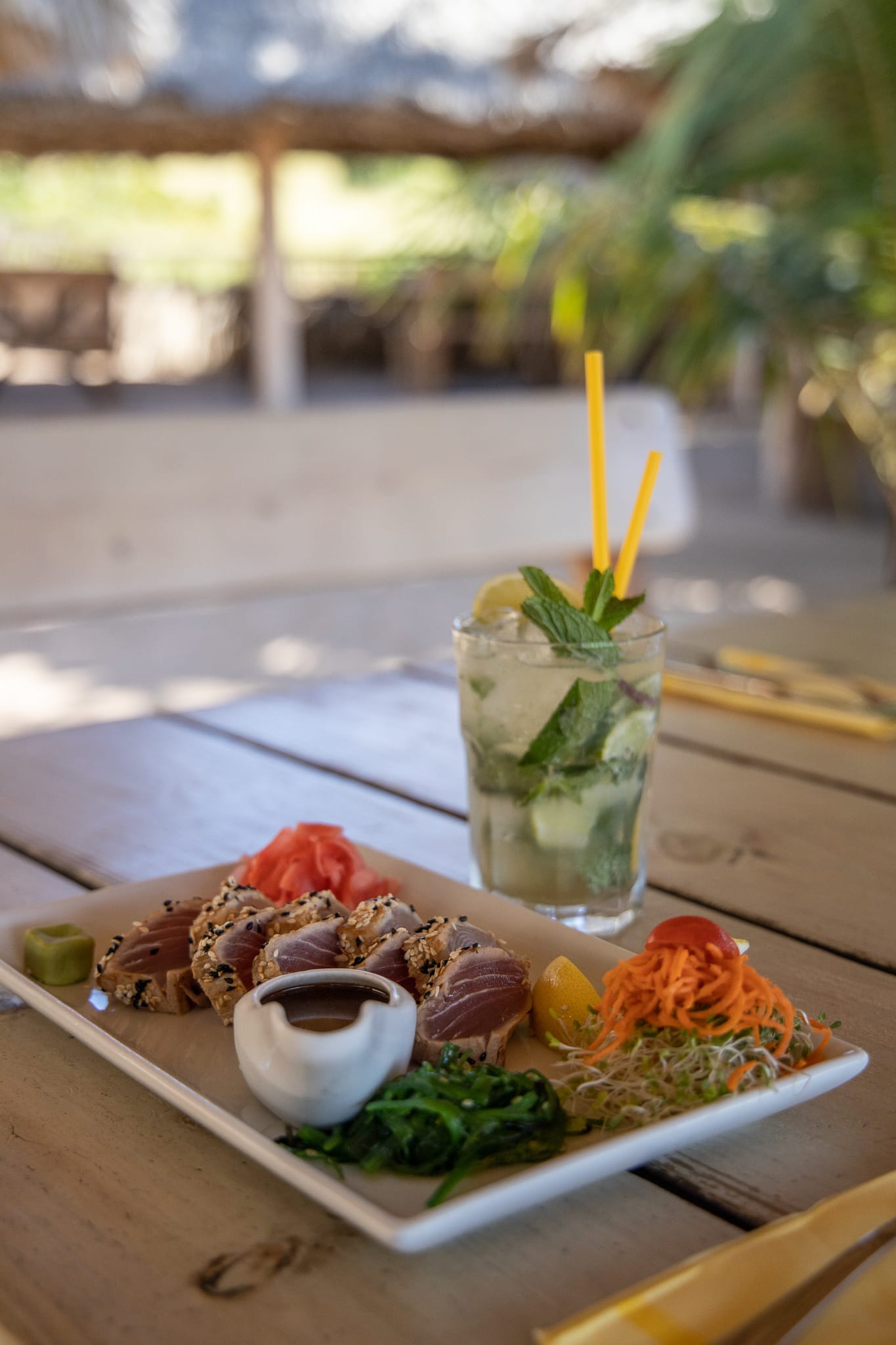 A plate of food and a drink on a table.