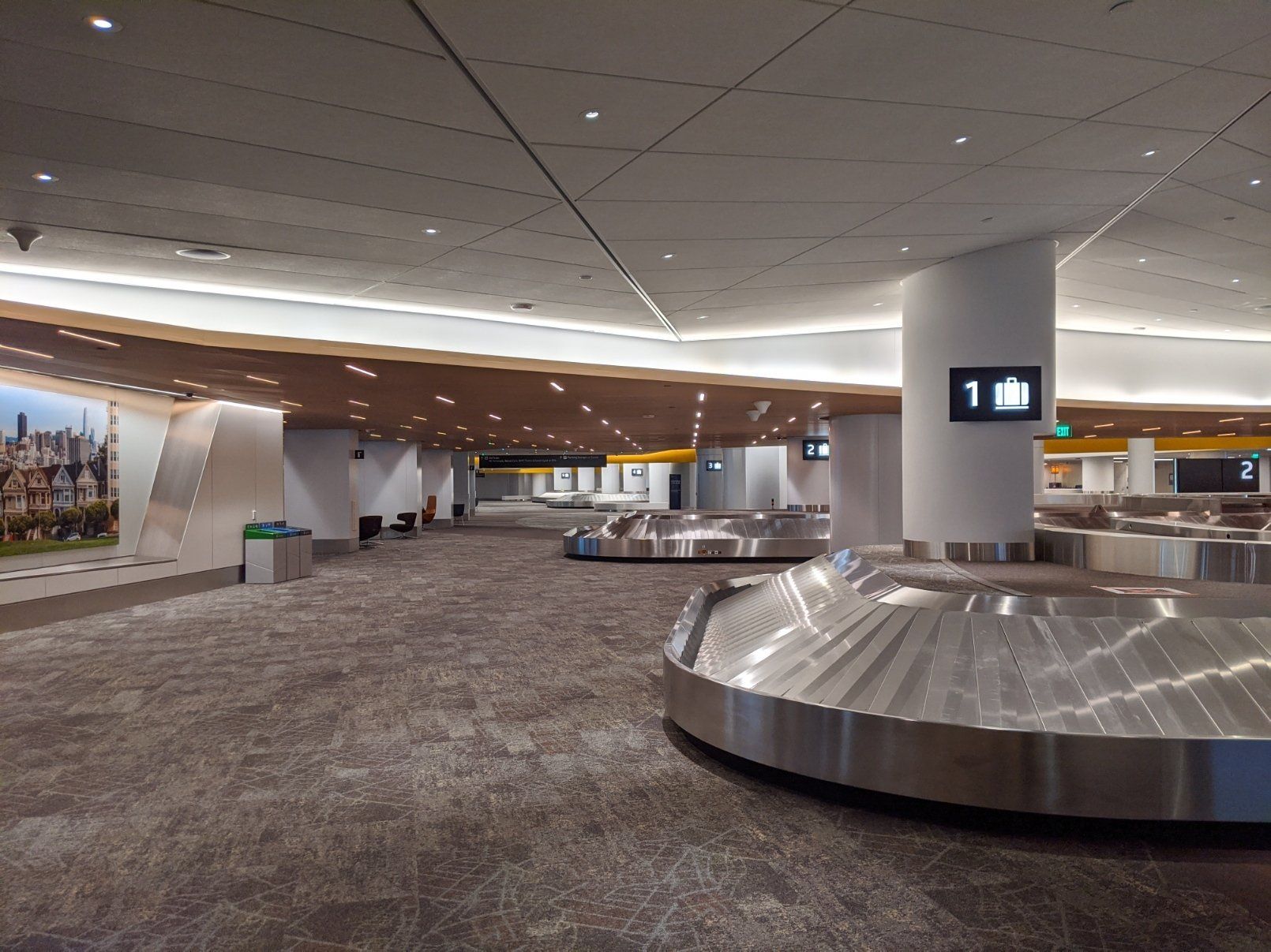 The baggage claim area of Harvey Milk terminal, shown empty and clean.