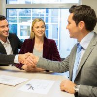 Shaking hands at business meeting
