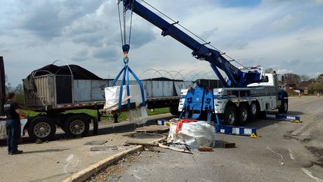 The Buckeye truck tows a large industrial truck