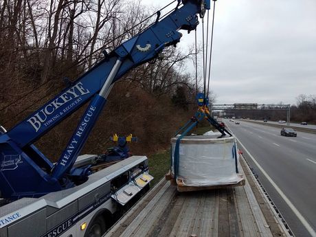 The Buckeye team assists a trailer that has toppled