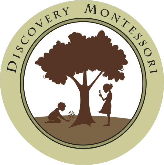 A logo for discovery montessori with a tree and two children
