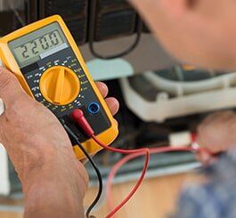 Repairman With Digital Multi Meter  — Appliance Repair in Wauwatosa, WI