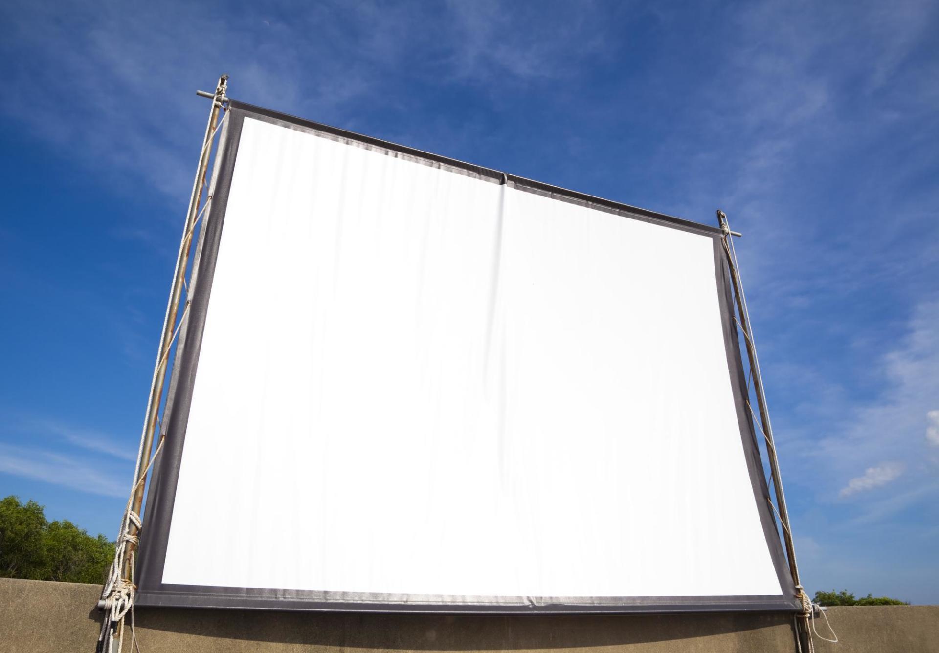 A large white screen with a blue sky in the background