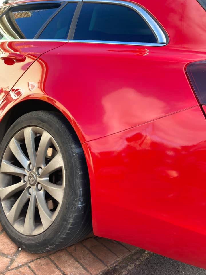 Red paintwork repair on estate car