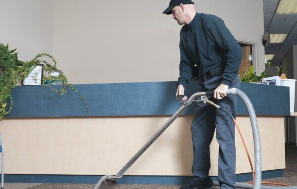 Man Using A Vacuum Cleaner — Man Using A Vacuum Cleaner —