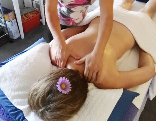 Person on table shoulder massage