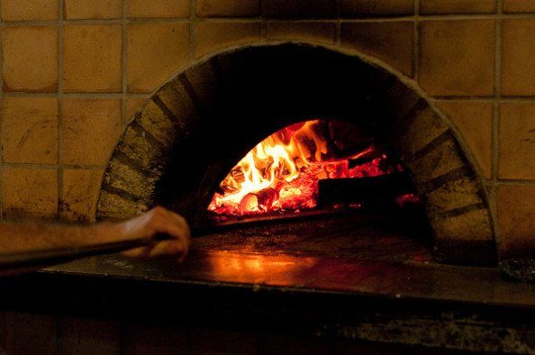pizzas baked in a wood-fired oven