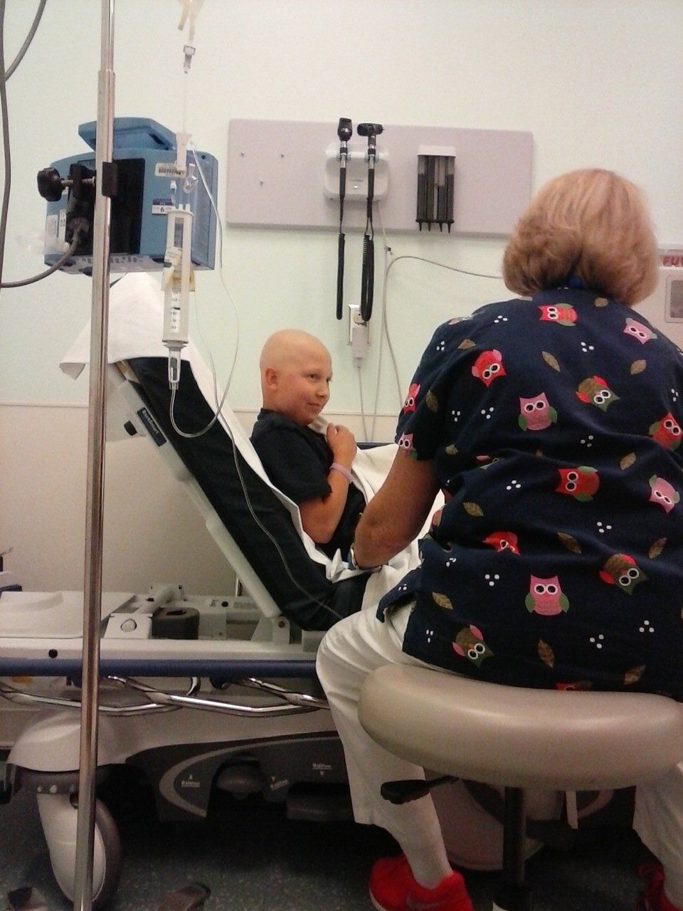 Samuel, boy getting blood drawn by nurse.