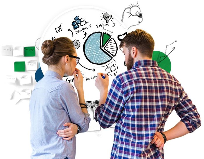 A man and a woman are looking at a pie chart on a whiteboard