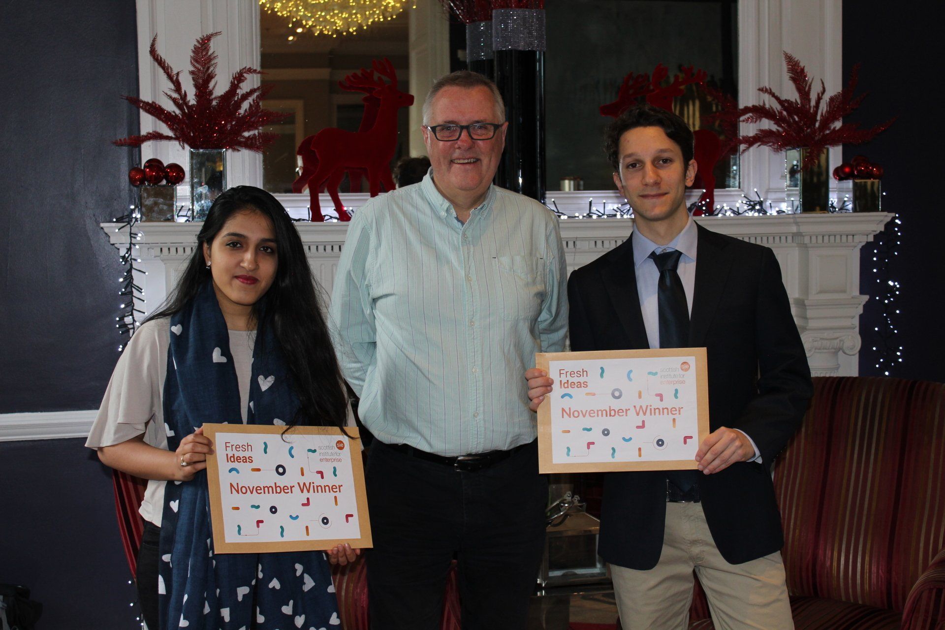 Crover CEO & Founder Lorenzo Conti being award with Fresh Ideas November award next to SIE advisor Tom McGuire
