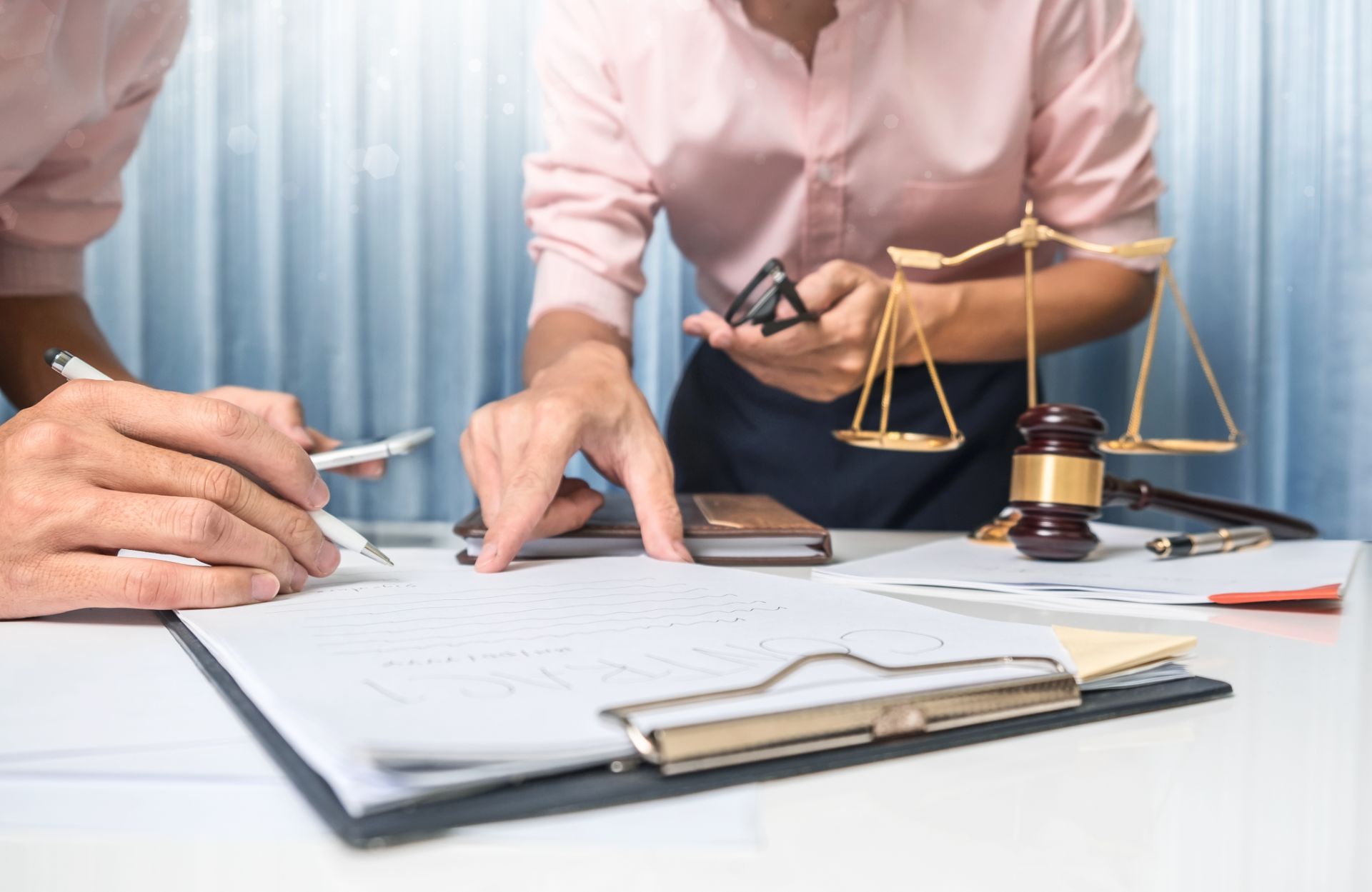 discussing a contract with a lawyer