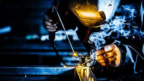 Man Working On Metal Welding — St. Louis, MO — Accurate Mechanical Contractors, Inc. Man Working On Metal Welding — St. Louis, MO — Accurate Mechanical Contractors, Inc.