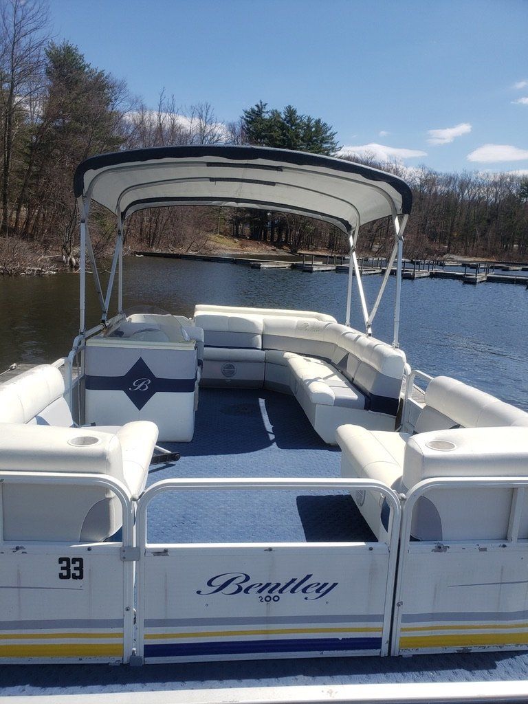 Pontoon boat on the water.