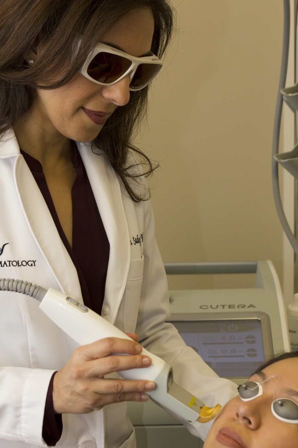Dr. Sadeghi at Pure Dermatology performing an Excel V laser treatment