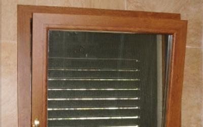 Finestra in legno e PVC con apertur a ribalta