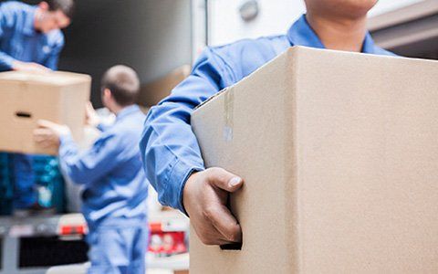 Movers unloading a moving van - Professional movers in Pass, OR
