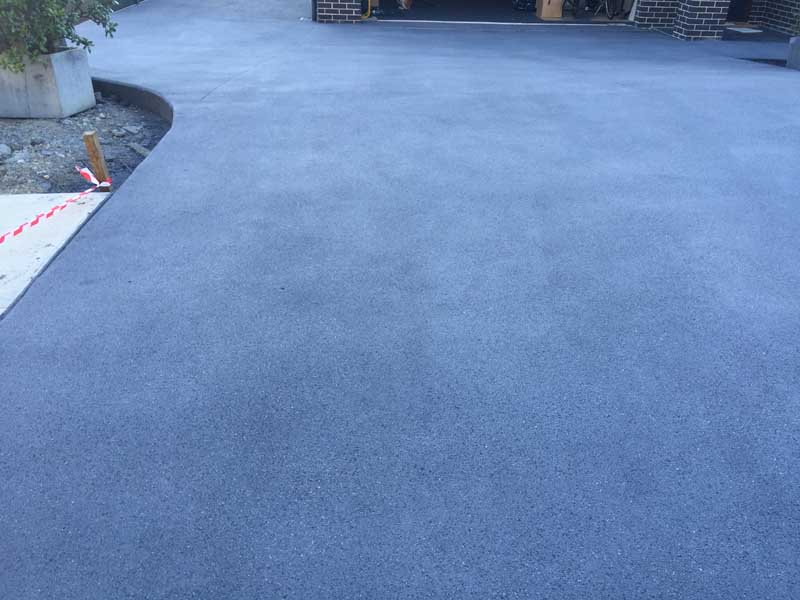 close up of concrete driveway at dusk