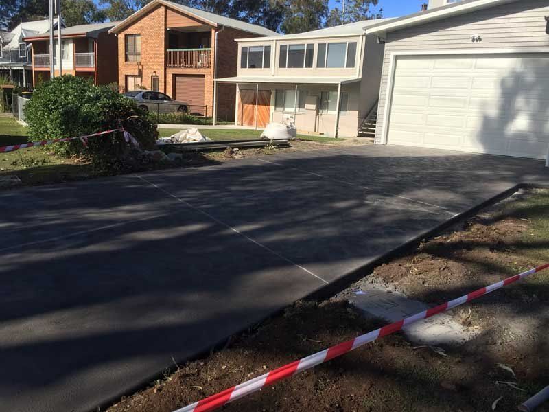 home with new concrete driveway