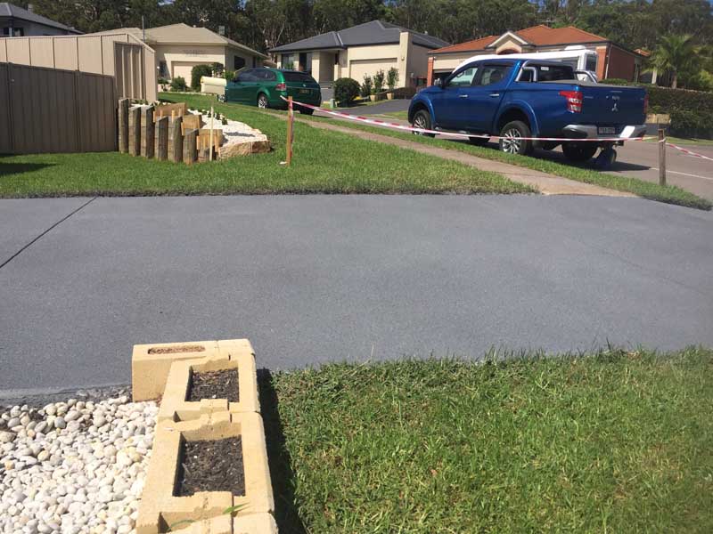 side of new concrete driveway