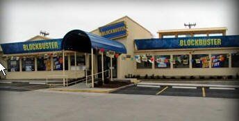 Blockbuster video rental store exterior with blue awning and signage.