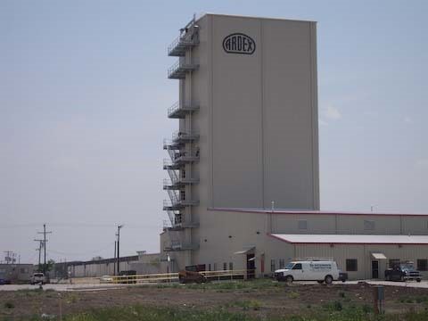 Large, beige industrial tower with 