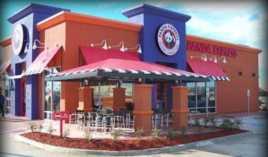 Panda Express restaurant with red awnings, outdoor seating, orange and blue exterior.