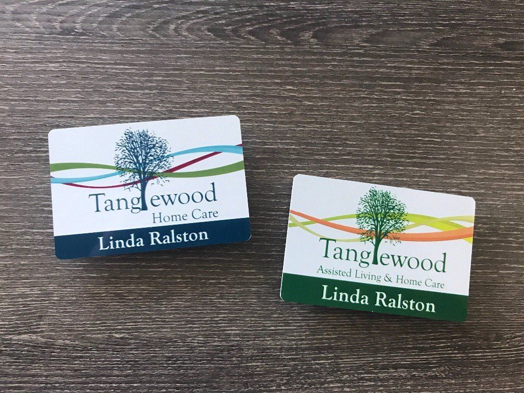 Two Tangewood Home books by Linda Ralston, one white and one green, on a wooden table