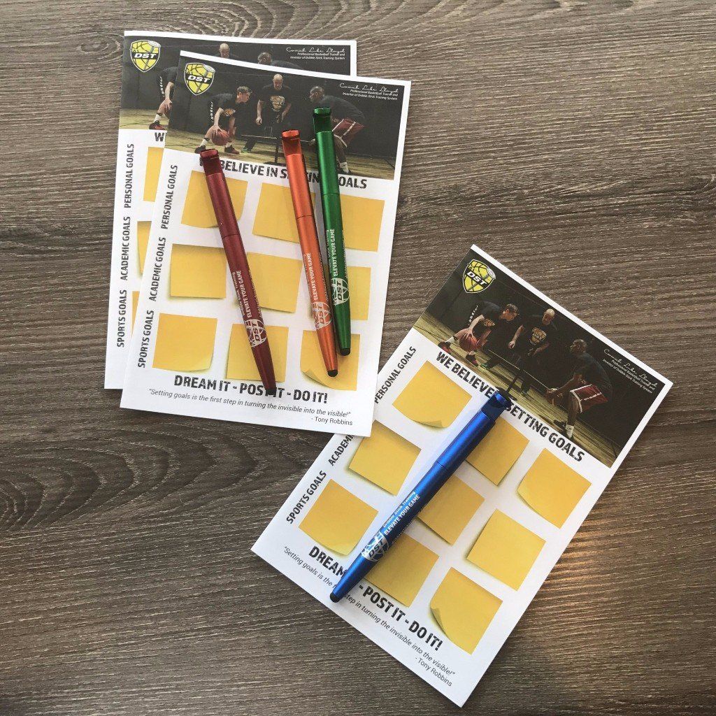Three colored pencils on educational cards on a wooden table, with one blue pencil separated nearby