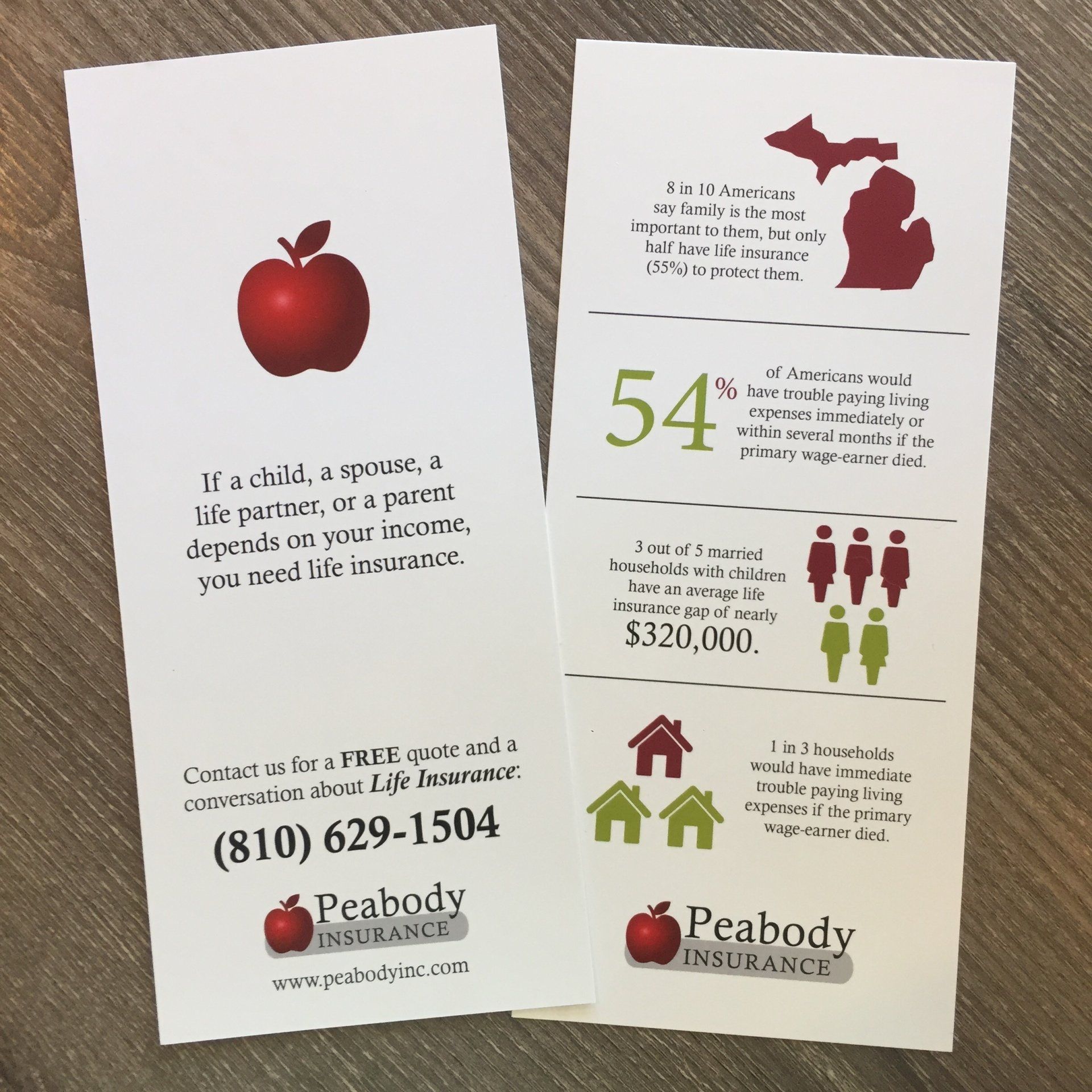 A brochure for peabody insurance has an apple on it