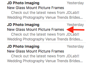 Email inbox showing repeated JD Photo Imaging messages about new glass mount picture frames, dated yesterday.