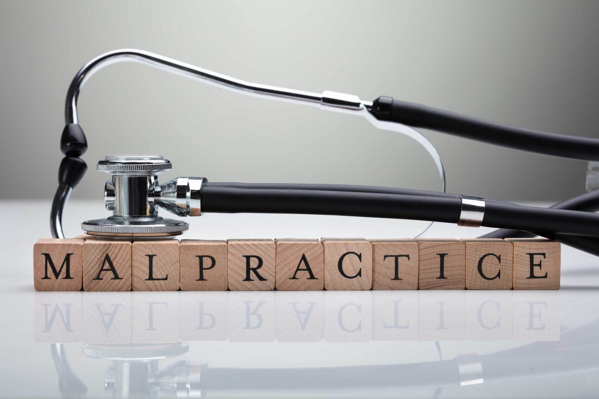 Stethoscope Over Malpractice Wooden Block — King Of Prussia, PA — McGilvery & Juliana Stethoscope Over Malpractice Wooden Block — King Of Prussia, PA — McGilvery & Juliana