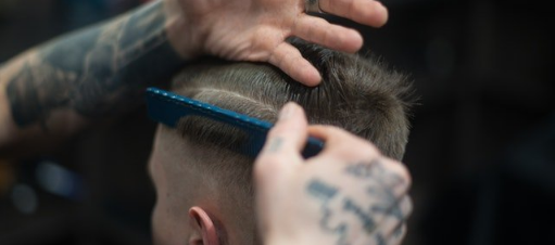 Barber Giving Customer a Fade Haircut