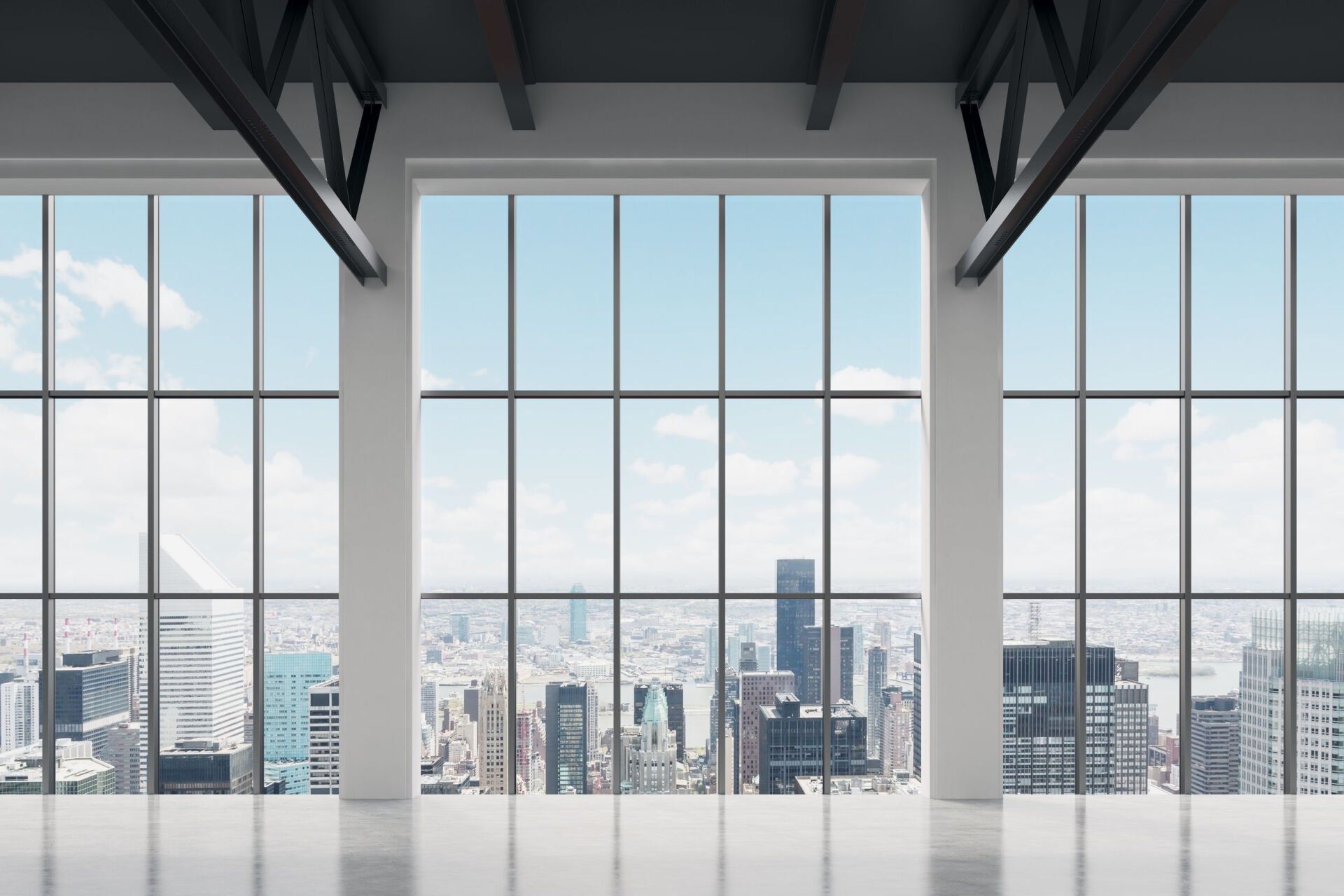 There are a lot of windows in this room with a view of the city.