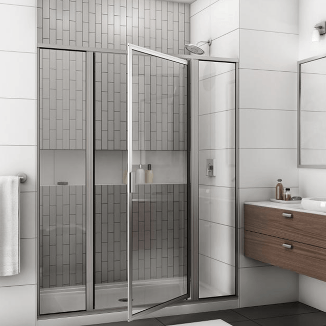 A bathroom with a walk in shower and a sink