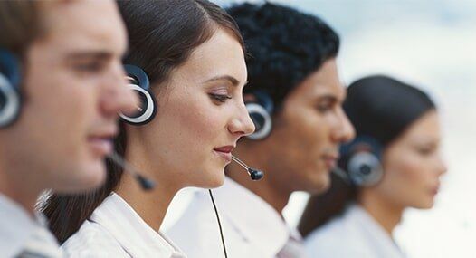 Young Men and Women Working in Call Center — Sales, Service, & Installations in Brooklyn, NY Young Men and Women Working in Call Center — Sales, Service, & Installations in Brooklyn, NY