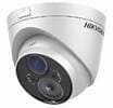 White dome security camera with dark lens, aimed downwards.