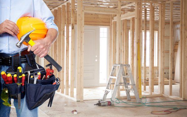Contractor standing in new home construction site