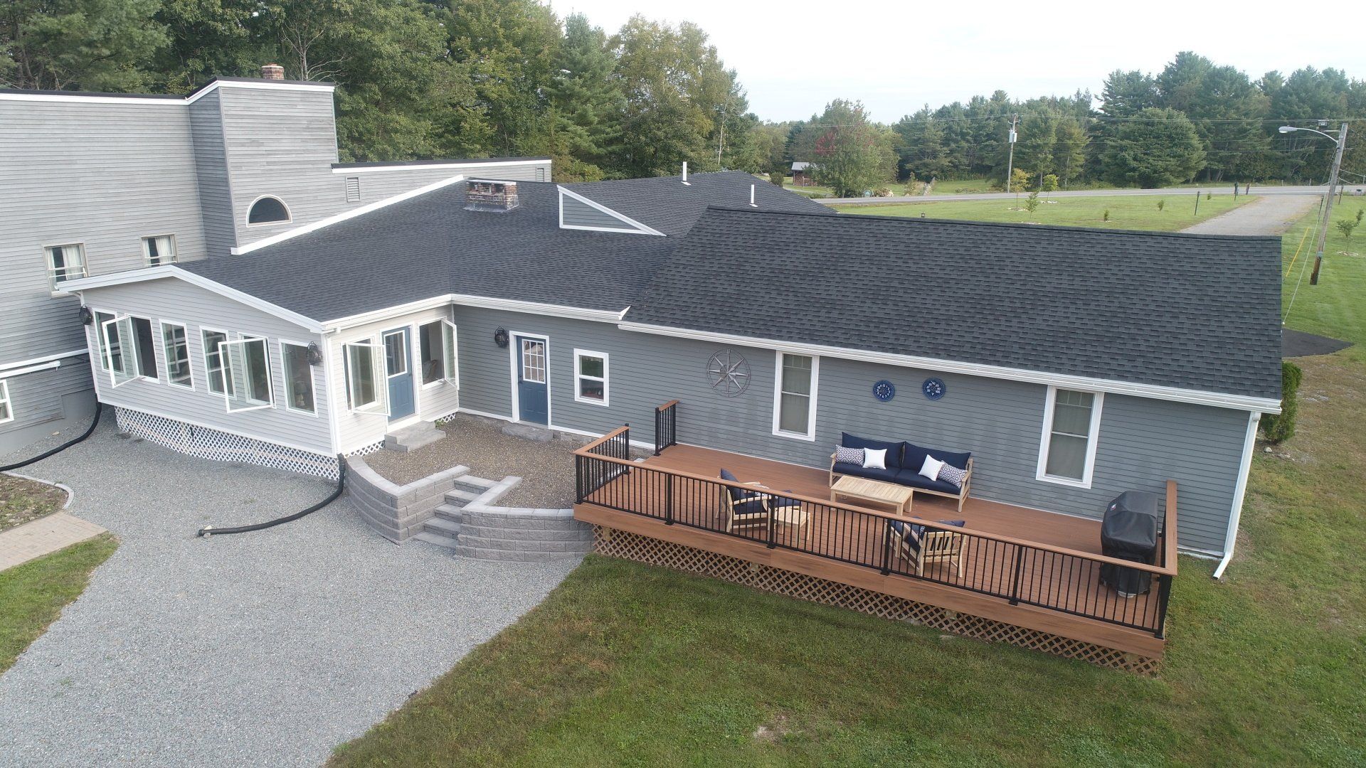 White House with Wooden Deck — Hampton, ME — Central Maine Exteriors