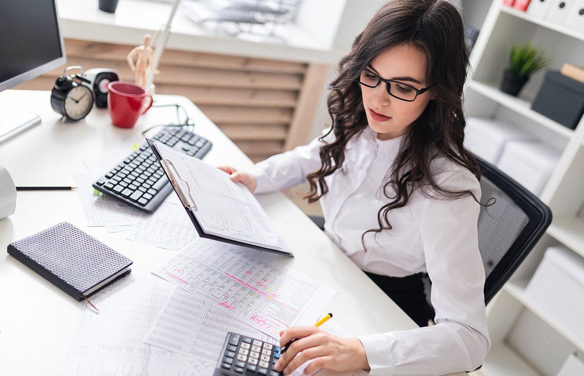 Woman Preparing the Financial Statement — Marianna, FL — LESLIE A. TUCKER, CPA, PA, CERTIFIED PUBLIC ACCOUNTANT Woman Preparing the Financial Statement — Marianna, FL — LESLIE A. TUCKER, CPA, PA, CERTIFIED PUBLIC ACCOUNTANT