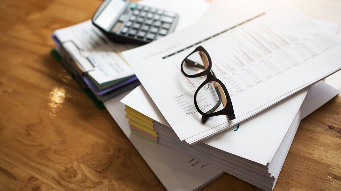 Eyeglass on Paper Documents — Marianna, FL — LESLIE A. TUCKER, CPA, PA, CERTIFIED PUBLIC ACCOUNTANT Eyeglass on Paper Documents — Marianna, FL — LESLIE A. TUCKER, CPA, PA, CERTIFIED PUBLIC ACCOUNTANT