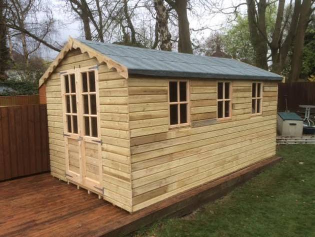 garden shed with a blue coloured roof