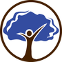 A person is standing in front of a tree with their arms outstretched.