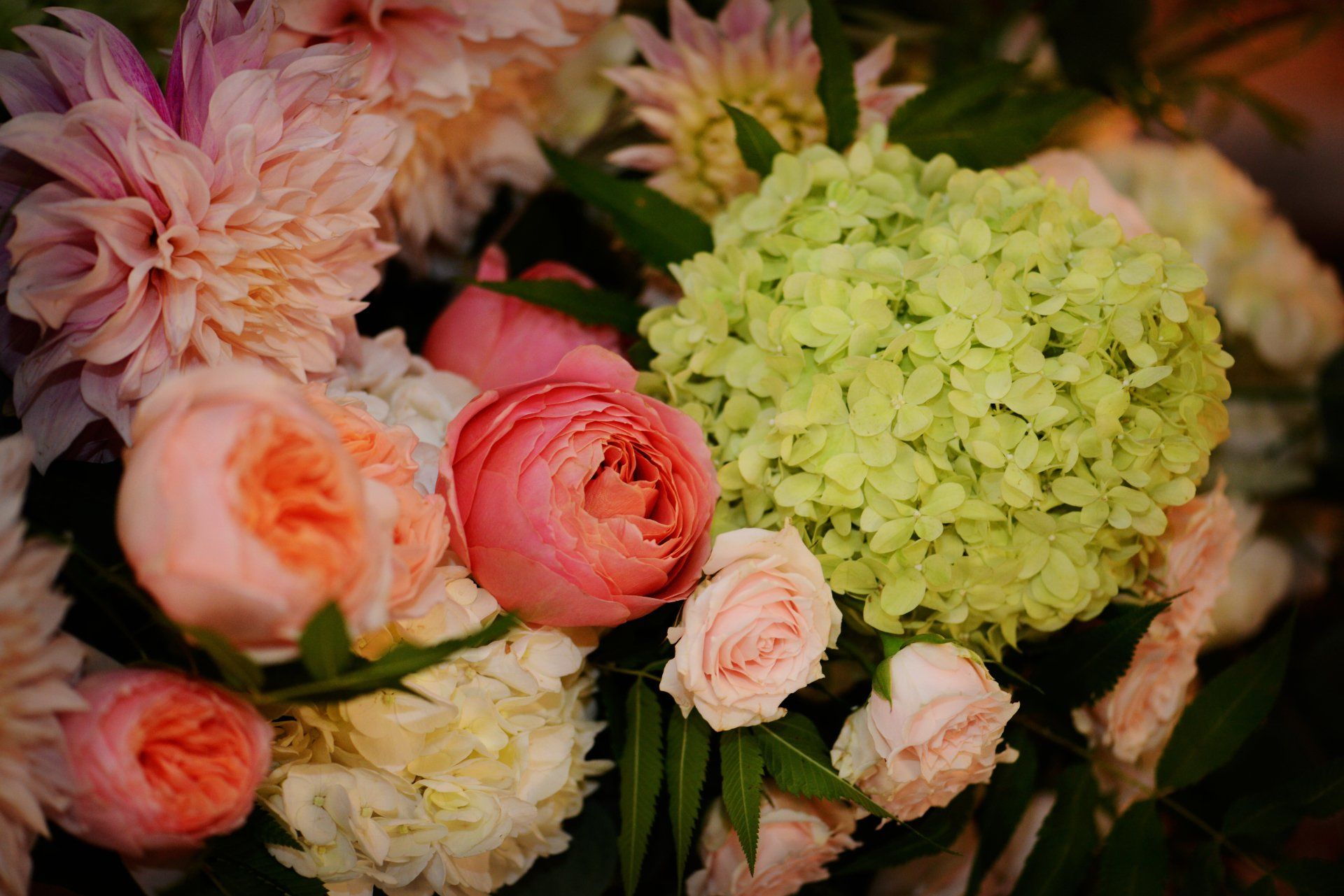 A close up of a bouquet of flowers on a table.