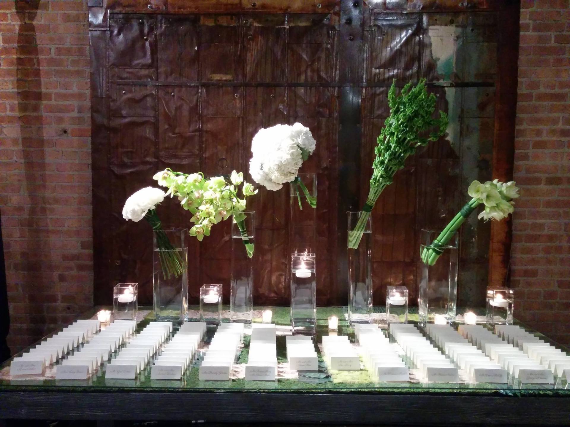 A table with flowers and candles on it