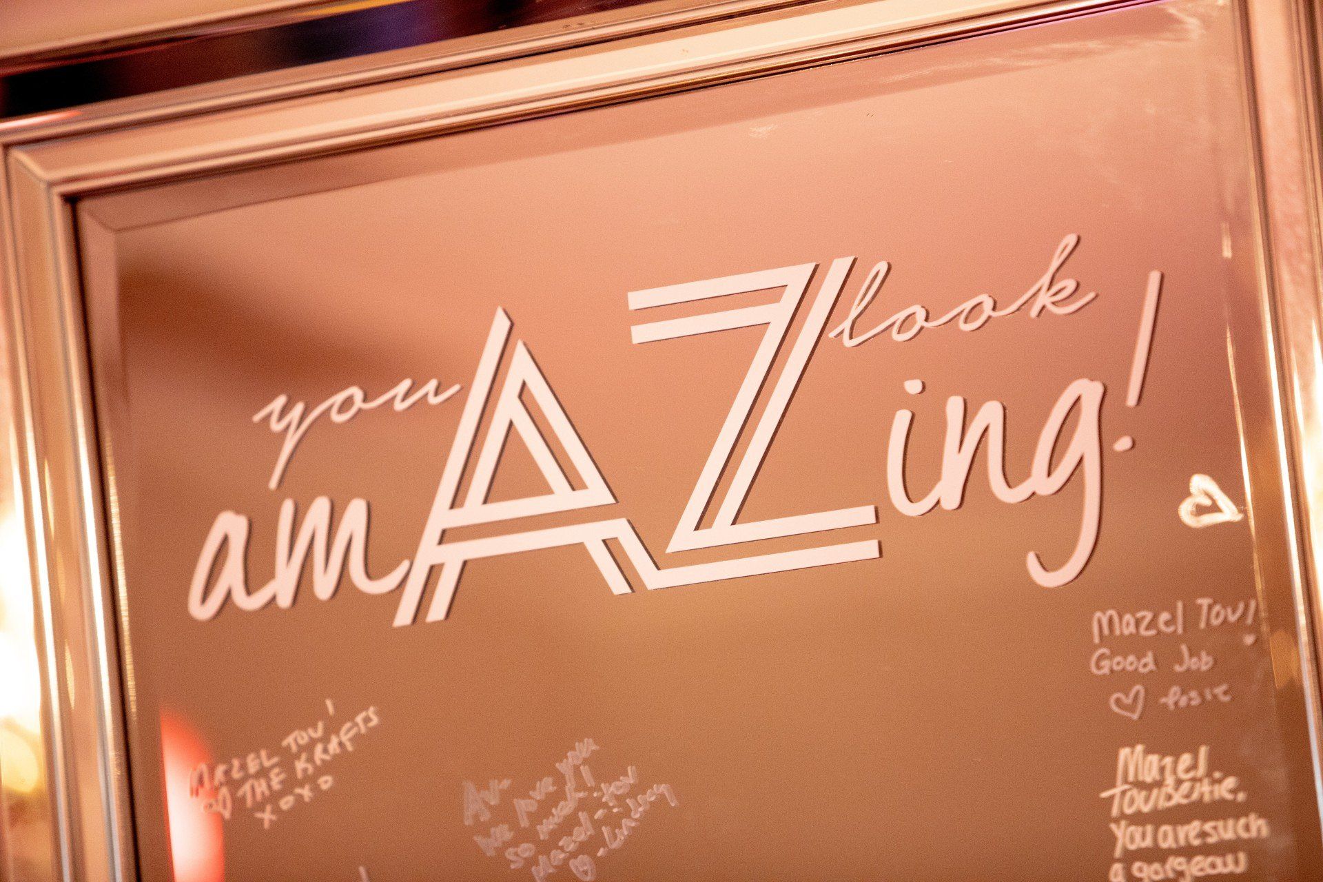 A mirror with the words `` you are amazing '' written on it