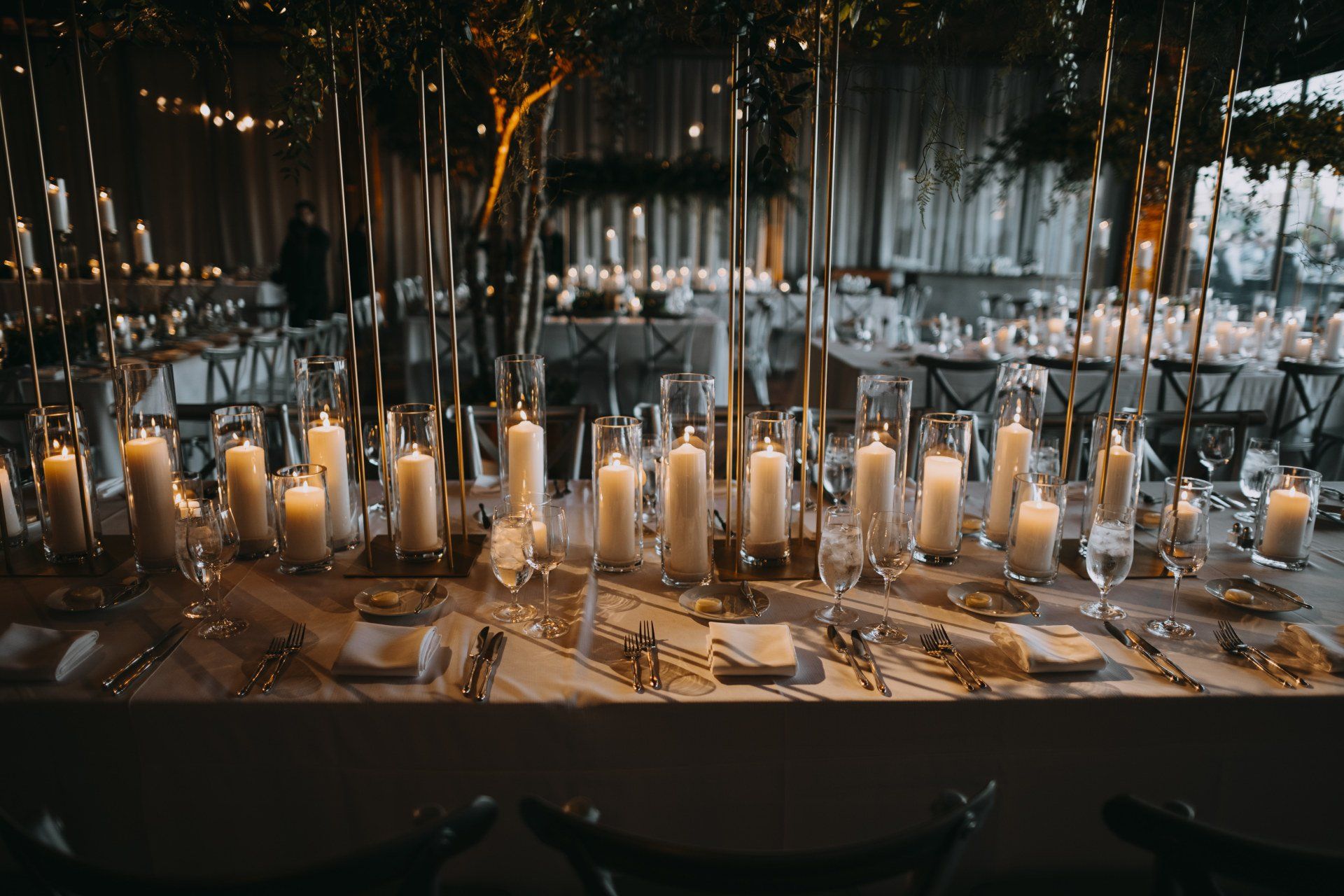 A long table with lots of candles on it.